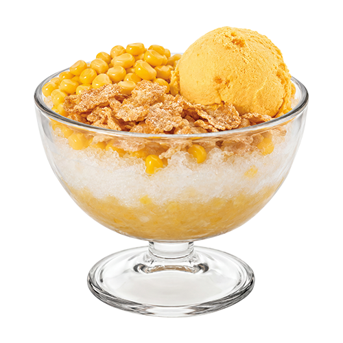 A clear glass dessert bowl with a pedestal base, filled with corn ice cream, corn kernels, and cereal pieces over a white shaved ice base, isolated on a white background.
