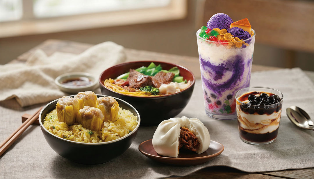 A variety of Chowking favorites arranged on a table, including siomai fried rice, beef wonton noodle soup, an open siopao, a tall ube Halo-Halo, and a layered boba dessert.