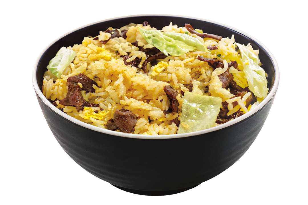 A black bowl filled with beef chao fan fried rice mixed with egg bits and green cabbage against a plain black background